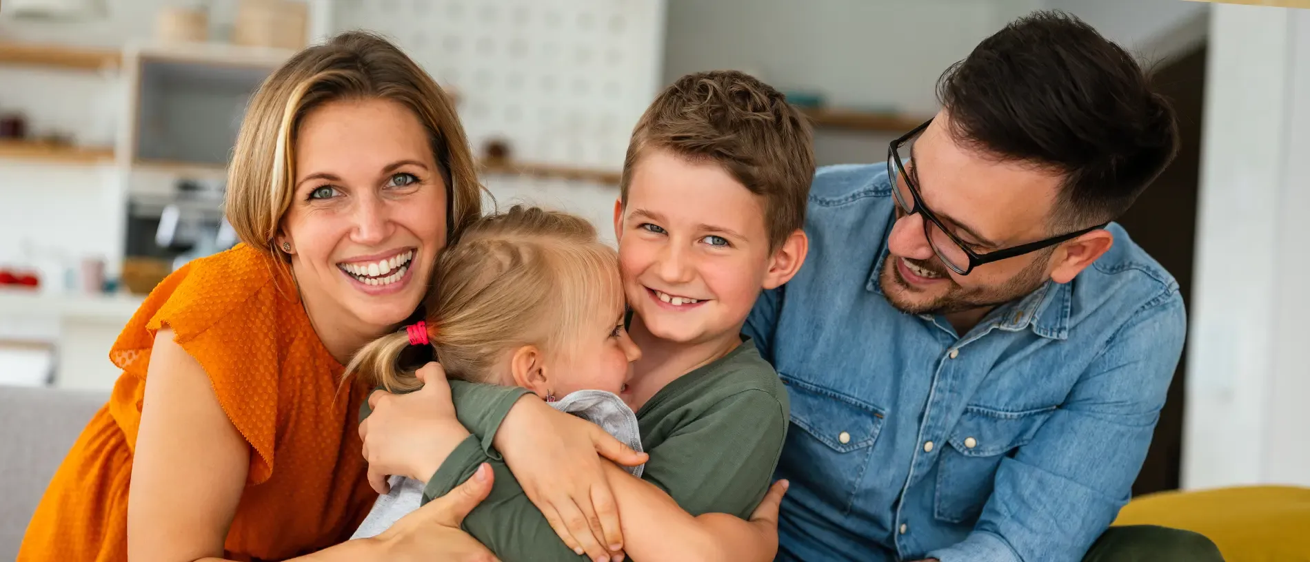 Smiling family with arms extended towards camera